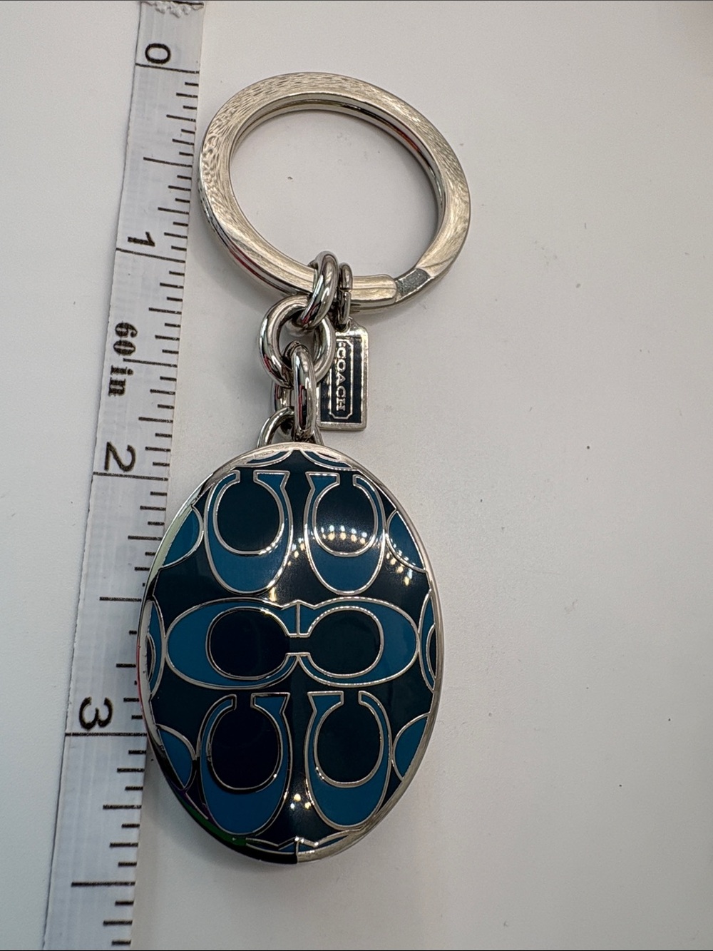 Coach Blue Enamel Oval Locket Keychain with Signature 'C' Pattern